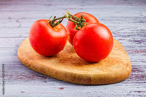 Fresh tomatoes on the cutting board