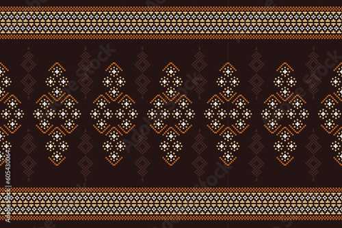 Ethnic geometric fabric pattern Cross Stitch.Ikat embroidery Ethnic oriental Pixel pattern brown background. Abstract,vector,illustration. Texture,clothing,scarf,decoration,carpet,silk wallpaper.