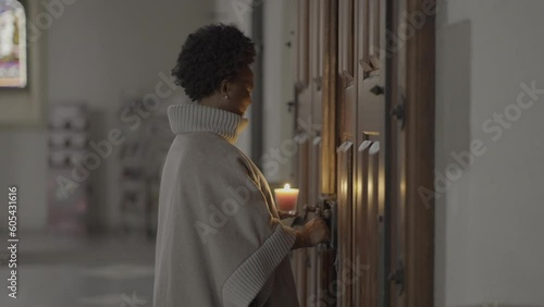 Hopeful Woman Believing in God Praying Inside Holy Church photo