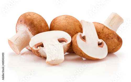 Fresh whole and sliced champignon mushrooms isolated on white background