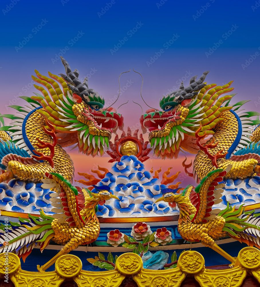 Colourful multicoloured dragon on top of a temple in Patong Phuket Thailand. beautiful blue green red of the scale dragons Colourful multicoloured dragon on top of a temple in Patong Phuket Thailand. beautiful blue green red of the scale dragons
