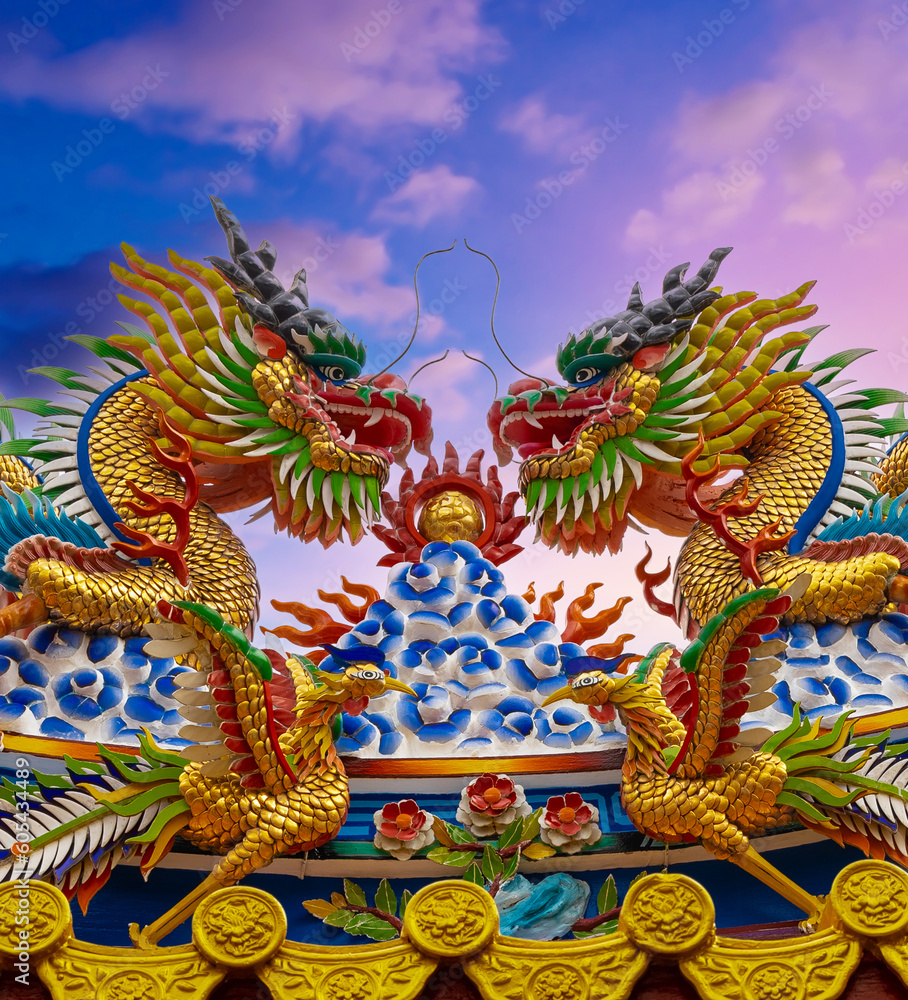 Colourful multicoloured dragon on top of a  temple in Patong Phuket Thailand. beautiful blue green red of the scale dragons