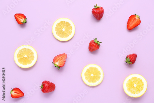 Fototapeta Naklejka Na Ścianę i Meble -  Fresh strawberries with lemon on lilac background