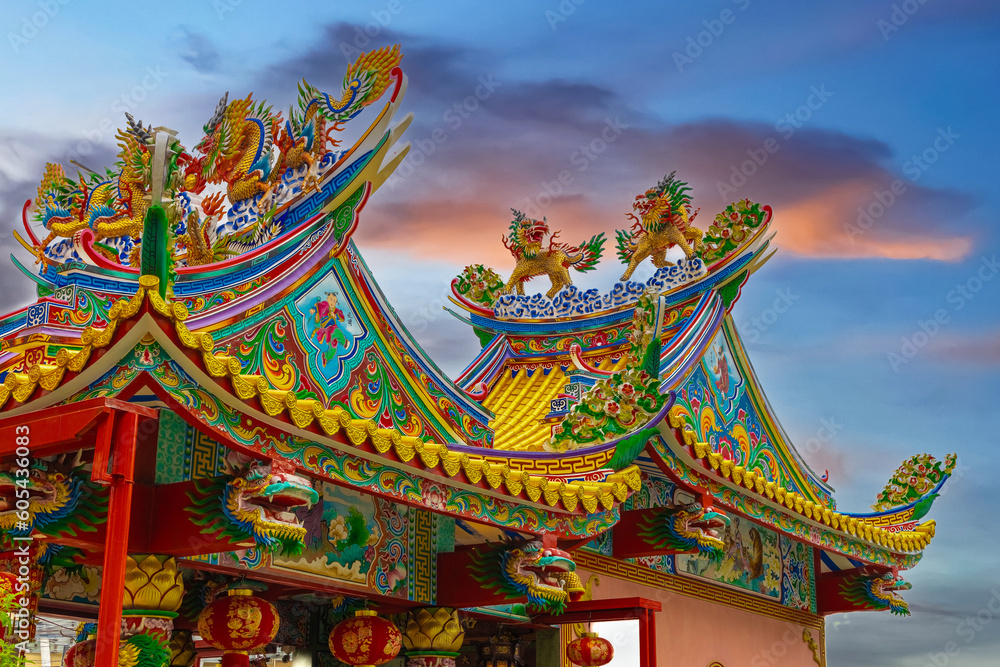 Colourful multicoloured dragon on top of a  temple in Patong Phuket Thailand. beautiful blue green red of the scale dragons