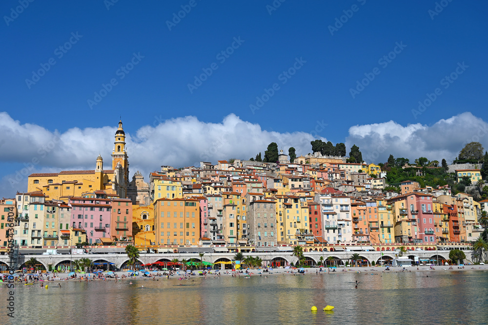 Beach and colorful old buildings in Menton South France summer season