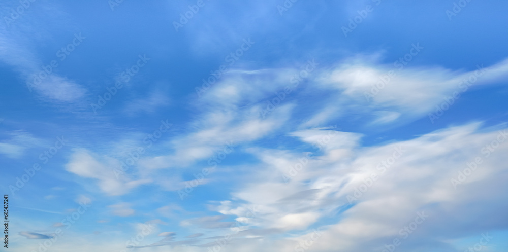 Bright blue sky with fine cirrus clouds, abstract nature background