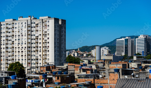 Contrast between buildings and houses in the favela of Rio de Janeiro, Brazil. Common reality in the city. Slum.