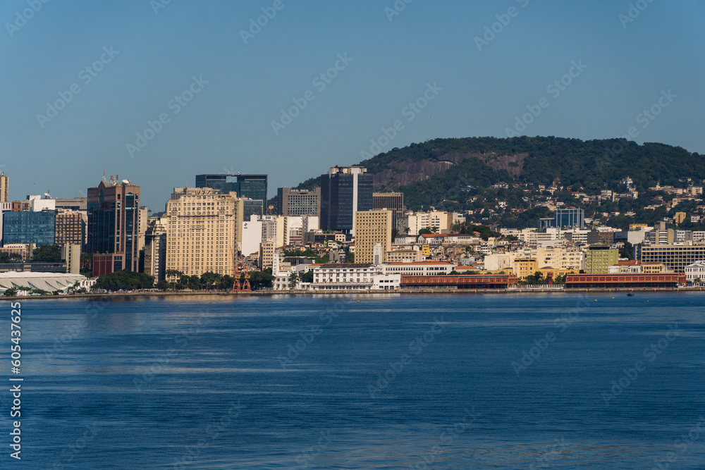Beautiful view of Guanabara Bay in Rio de Janeiro, Brazil with the port, hills and buildings in the background. Beautiful landscape and hill with the sea. Sunny day
