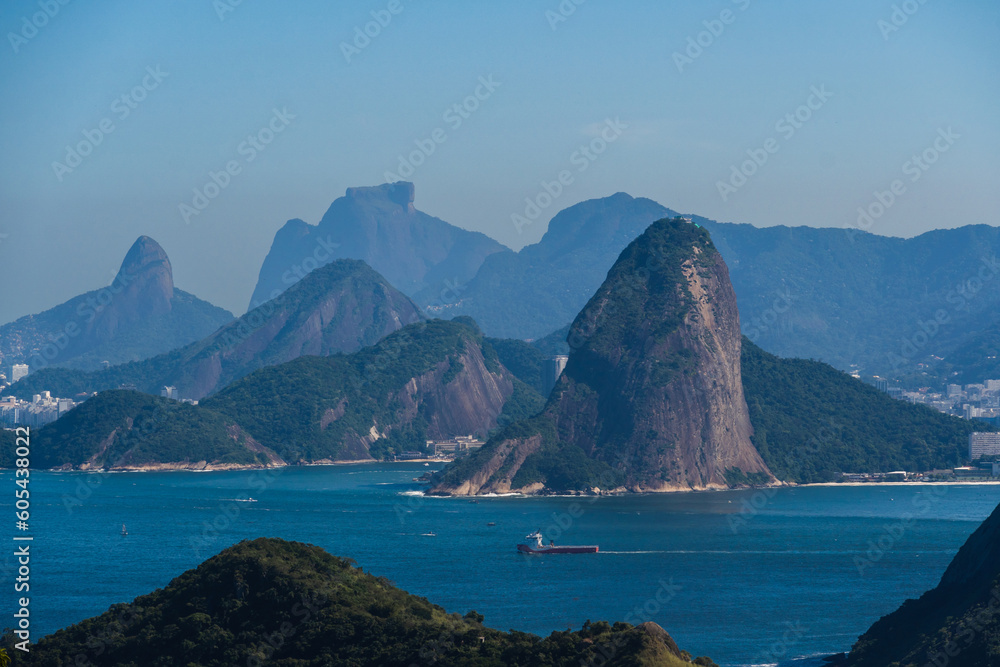 Beautiful view of Rio de Janeiro, Brazil seen from Niterói. With many hills in the background, Guanabara Bay, Jujuruba, Morro do Pão de Açucar, beaches, pier with boats. Sunny day Beautiful view of Rio de Janeiro, Brazil seen from Niterói. With many hills in the background, Guanabara Bay, Jujuruba, Morro do Pão de Açucar, beaches, pier with boats. Sunny day