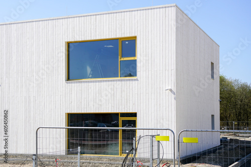Fotografi Construction site of a new nursery school building, facade fragment, temporary p