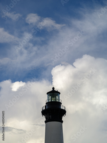 Vertical of the Bodie Island Lighthouse in front of huge storm clouds on Bodie Island Outer Banks of North Carolina