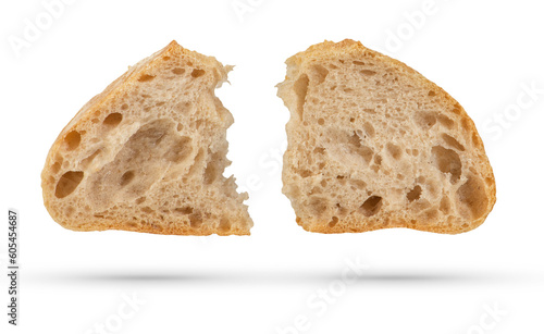 Two slices of fresh Ciabatta bread on a white isolated background. Slices hang or fall on a white background. The concept of Italian bread baking or delicious breakfast.