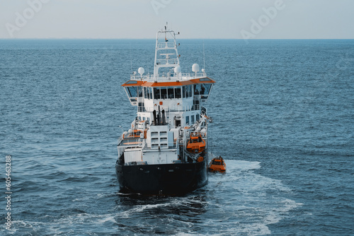 The pilot vessel on duty off the coast of the Netherlands. Search and rescue vessel at sea. Search and rescue operation. Lifeboat drill. Emergency response at sea.