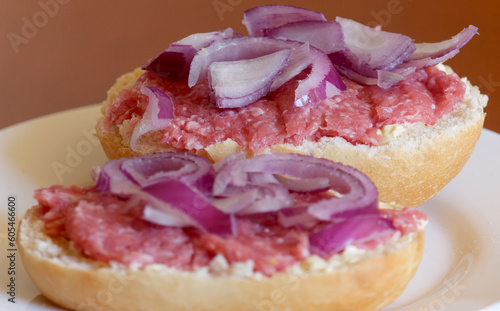 Two half-mead rolls with red onions, closeup