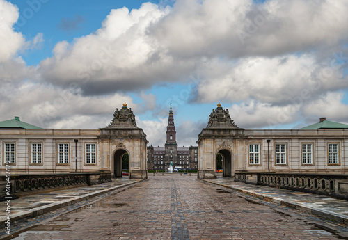 Copenhagen, Denmark - September 14, 2010: From Marmor bridge looking at Western entrance to Christiansborg Slot under thick blue cloudscape. 