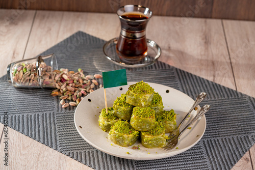 Traditional turkish baklava pistachio pastry. Dilberdudagi, ozel kesim baklava, cikolatali baklava, fistikli baklava, katmer, fistikli kadayif, kattafi, fistik sarma
 photo