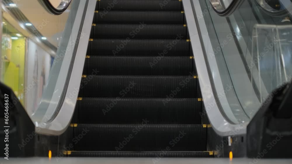 Empty escalator moving continuously in a shopping mall Empty escalator moving continuously in a shopping mall