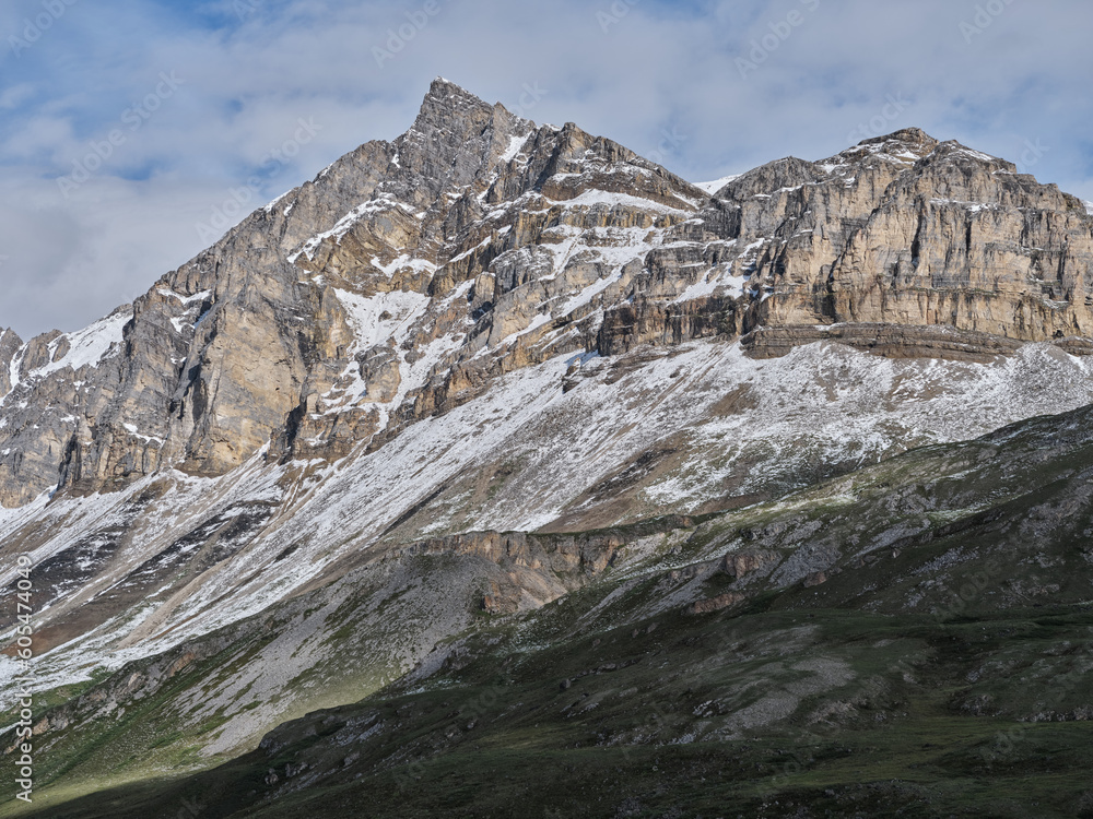 Fresh July snow fallen on the rugged granite mountain peaks on the Dalton Highway near Nuiqsut Alaska's First Nations people village