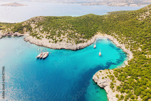Aerial shot with yachts resting in beautiful Akvaryum koyu in Bodrum, Turkey