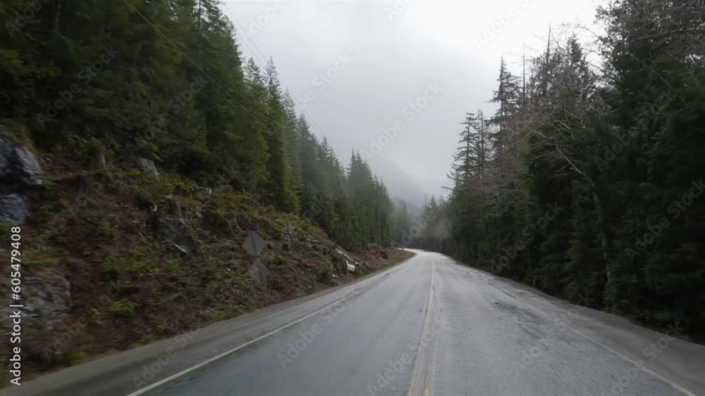 Scenic Road in Canadian Nature from Port Alberni to Tofino. Pacific Rim Hwy, Vancouver Island, British Columbia, Canada. Cloudy Rainy Day Scenic Road in Canadian Nature from Port Alberni to Tofino. Pacific Rim Hwy, Vancouver Island, British Columbia, Canada. Cloudy Rainy Day