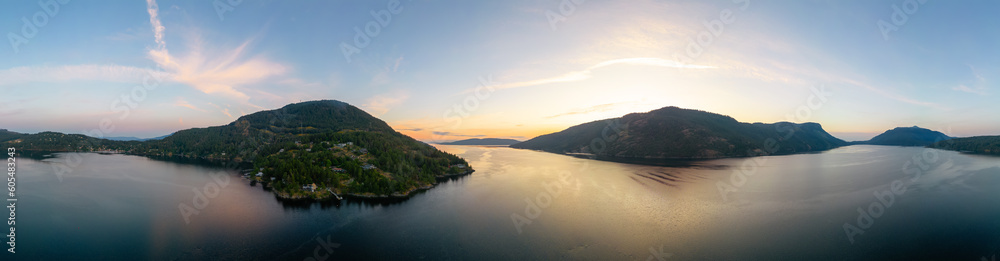 Aerial Panoramic View of Islands on the West Coast of Pacific Ocean. Sunny Sunrise Sky. Maple Bay, Vancouver Island, British Columbia, Canada.