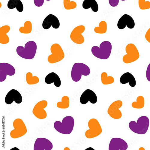 Seamless pattern of hand drawn colorful hearts in trendy Hallowing hues. Abstract background texture