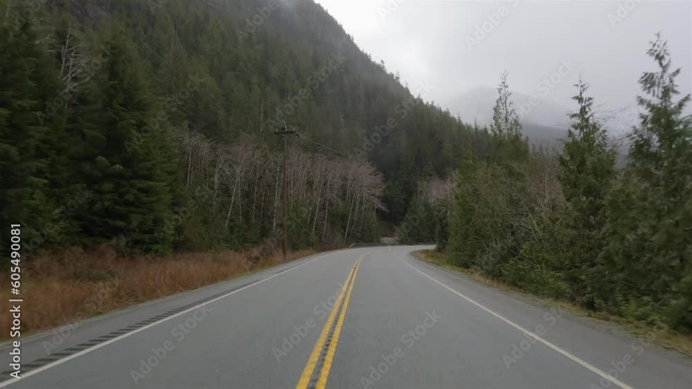 Scenic Road in Canadian Nature from Port Alberni to Tofino. Pacific Rim Hwy, Vancouver Island, British Columbia, Canada. Cloudy Rainy Day Scenic Road in Canadian Nature from Port Alberni to Tofino. Pacific Rim Hwy, Vancouver Island, British Columbia, Canada. Cloudy Rainy Day