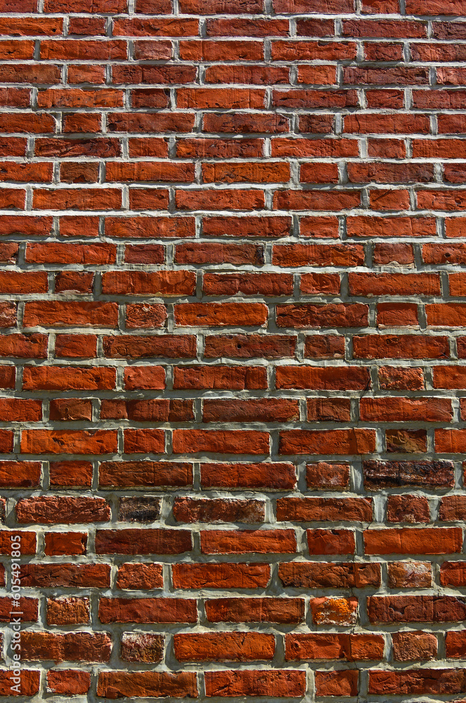Obraz premium an old wall of old red brick, an old building, as a background 2