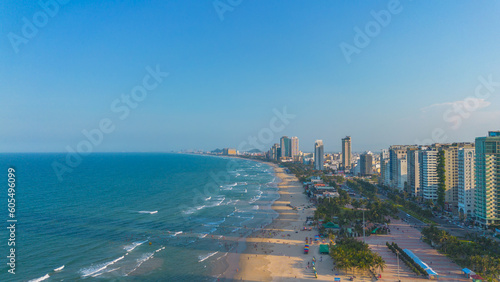 Aerial sunset view of Da Nang coastline. My Khe beach seafront with high-rise hotels and skyscrapers in the golden sand beach