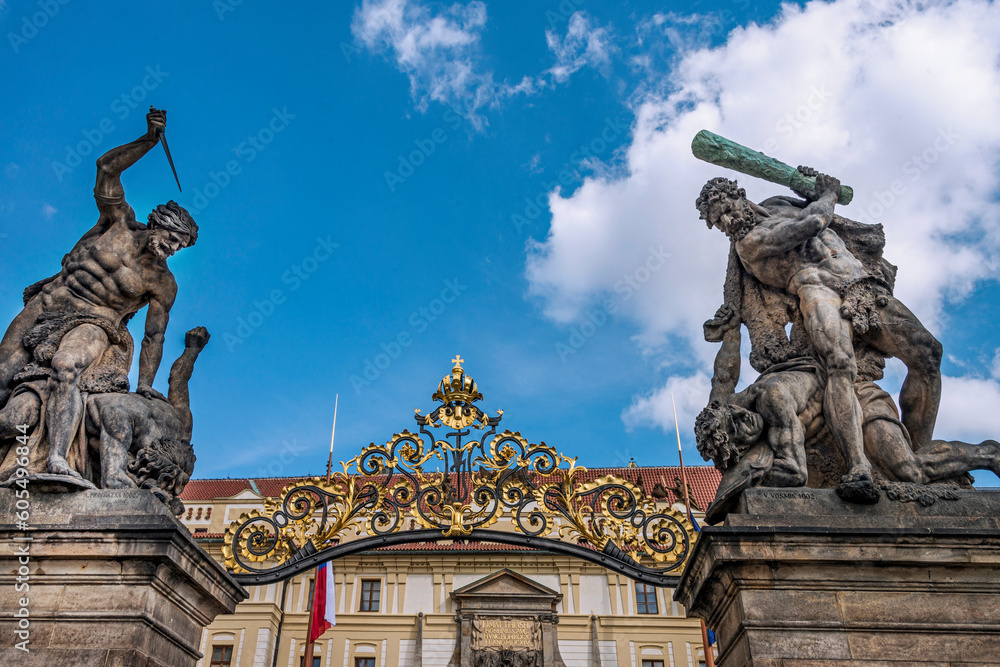 Entrance of the Prague Castle, decorated with a Rococo grille with massive sculptures of Battling Giants (Titans). The Prague Castle is the largest ancient castle in the world,  Czech Republic, 2018