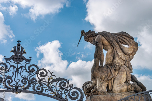 Entrance of the Prague Castle  decorated with a Rococo grille with massive sculptures of Battling Giants  Titans . The Prague Castle is the largest ancient castle in the world   Czech Republic  2018