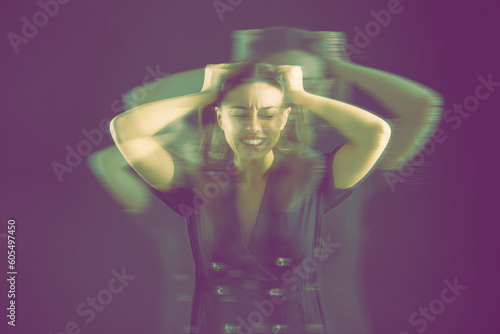Tableau sur toile Woman suffering from paranoia on purple background, glitch effect