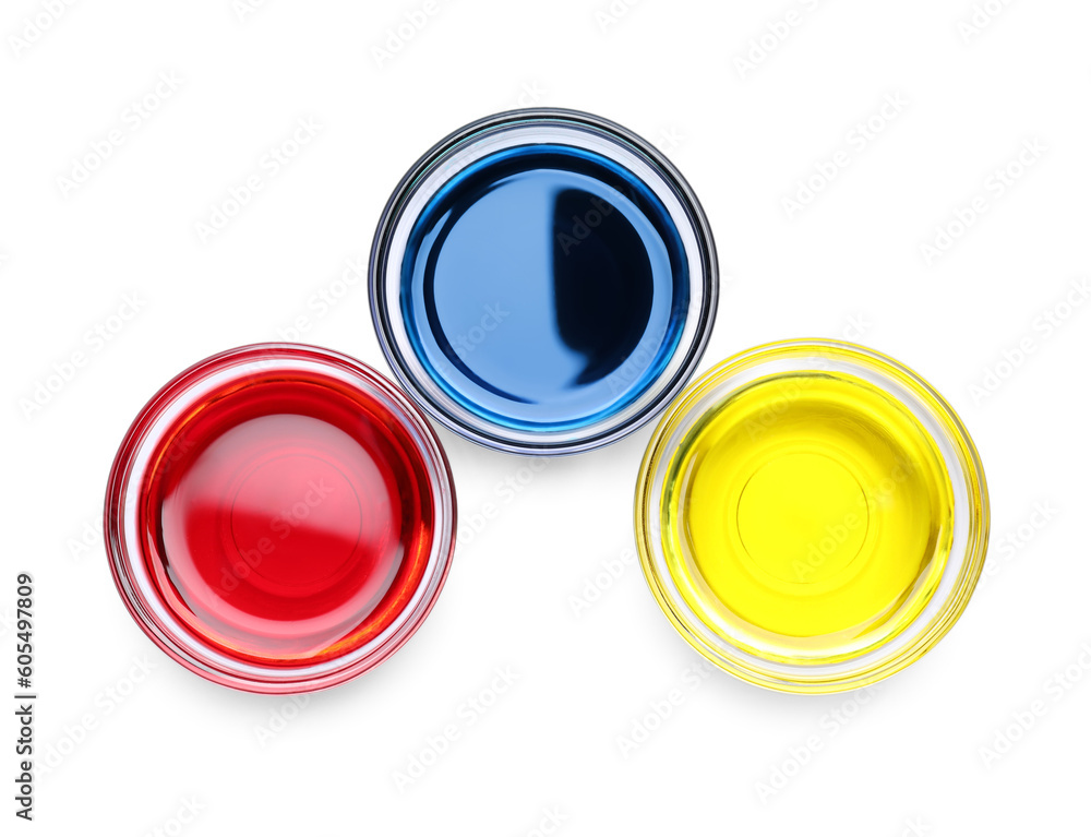 Glass bowls with different food coloring on white background, top view Glass bowls with different food coloring on white background, top view
