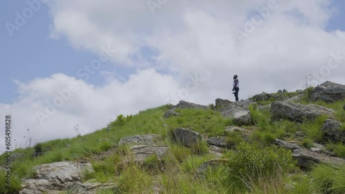 Man enjoying the landscape with sky and clouds photo