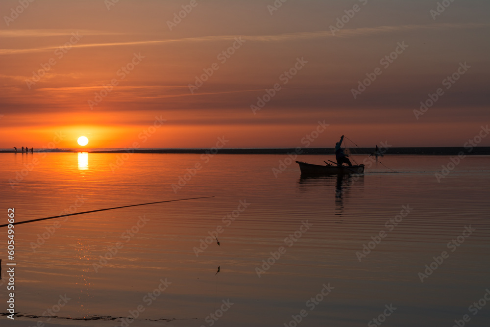 Fishing rod spinning, Fishing rod in rod holder and boat due the fishery day at the sunset. Rod rings. Fishing tackle. Fishing spinning reel, carp fishing. Angler, at sunse, Algeria in Africa.