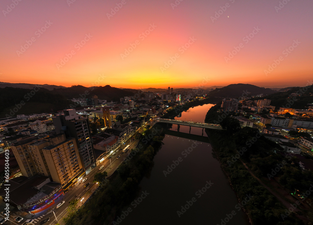 Aerial drone footage of the late afternoon with a beautiful sunset in Blumenau in Santa Catarina