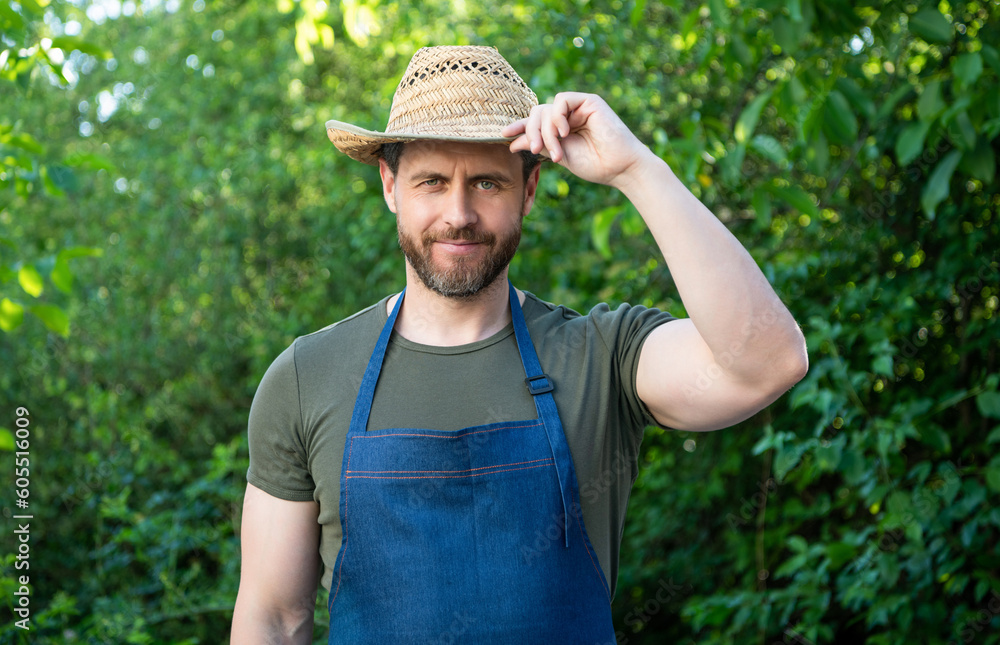Agricultural worker man tipping hat and smiling natural outdoors