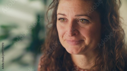 Brown-haired woman drying tears after discussing distressing news in a therapy session. This powerful footage highlights the importance of mental health support in challenging times