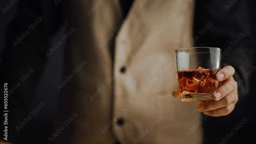 Bartender serving whiskey on wooden bar ,Close-up shot of whiskey glass Bartender serving whiskey on wooden bar ,Close-up shot of whiskey glass