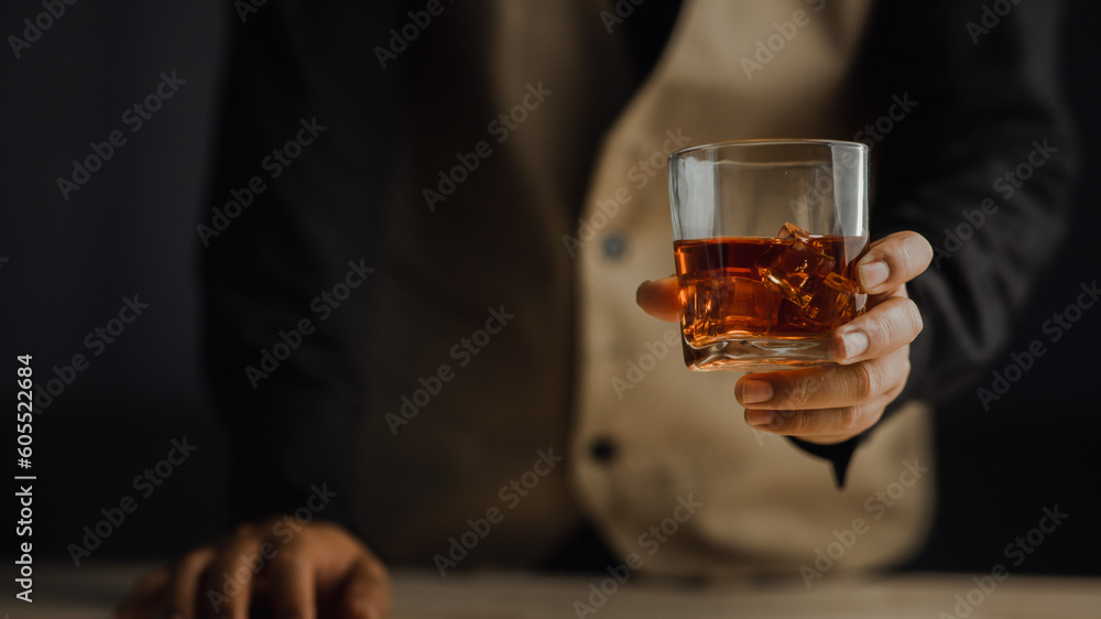 Bartender serving whiskey on wooden bar ,Close-up shot of whiskey glass Bartender serving whiskey on wooden bar ,Close-up shot of whiskey glass