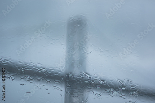 Photography During a big storm, raindrops hit the window of a ferry crossing from San Francisco to Oakland