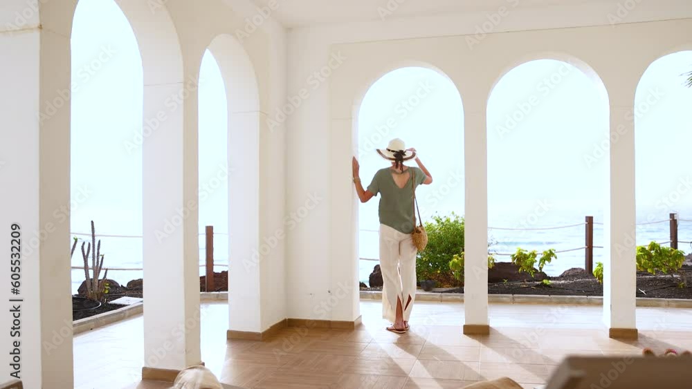 Elegant lady arriving at luxury Mediterranean spa resort Elegant lady arriving at luxury Mediterranean spa resort