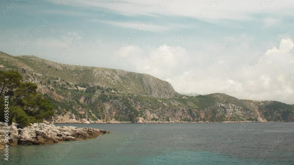 Timelaps of clouds scrolling on the beach of the island of Lokrum, off Dubrovnik, Croatia Timelaps of clouds scrolling on the beach of the island of Lokrum, off Dubrovnik, Croatia
