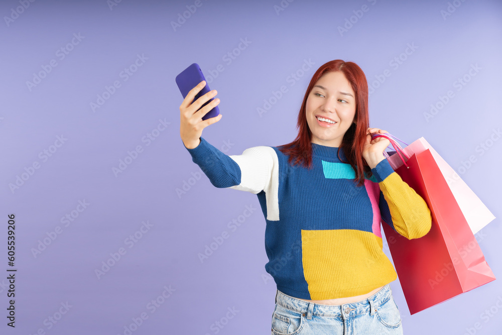 girl taking a selfie and carrying shopping bags girl taking a selfie and carrying shopping bags