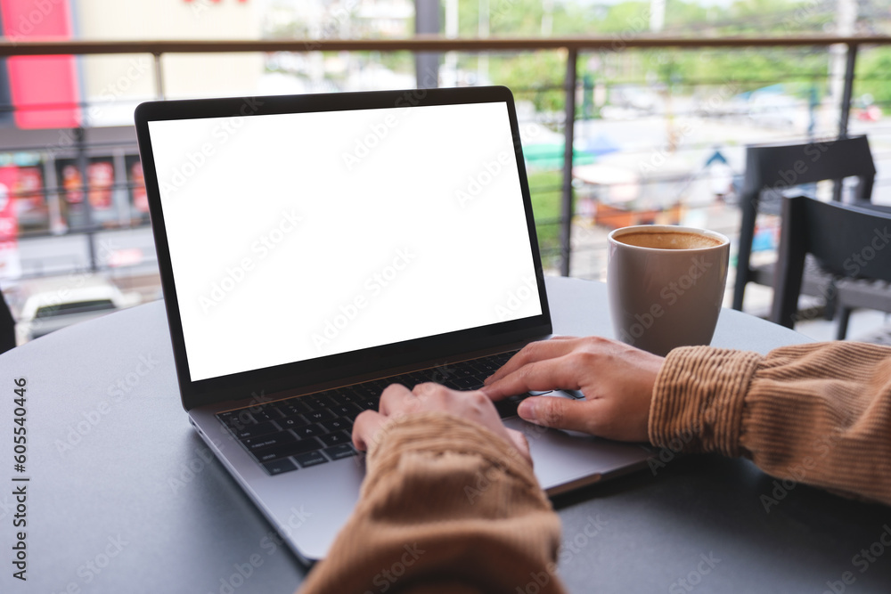 Mockup image of a woman using and working on laptop computer with blank white desktop screen Mockup image of a woman using and working on laptop computer with blank white desktop screen
