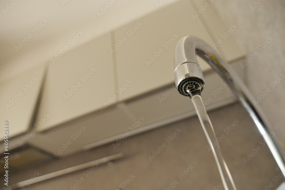 water pouring from a faucet tap slow motion water pouring from a faucet tap slow motion