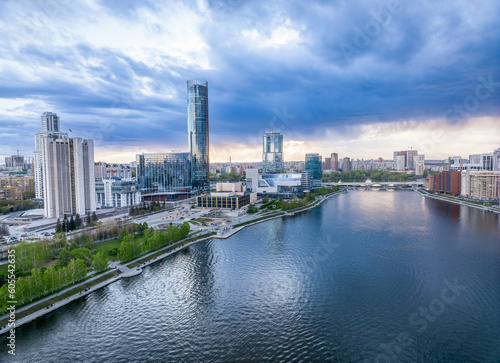 Yekaterinburg city and pond aerial panoramic view at summer sunset.