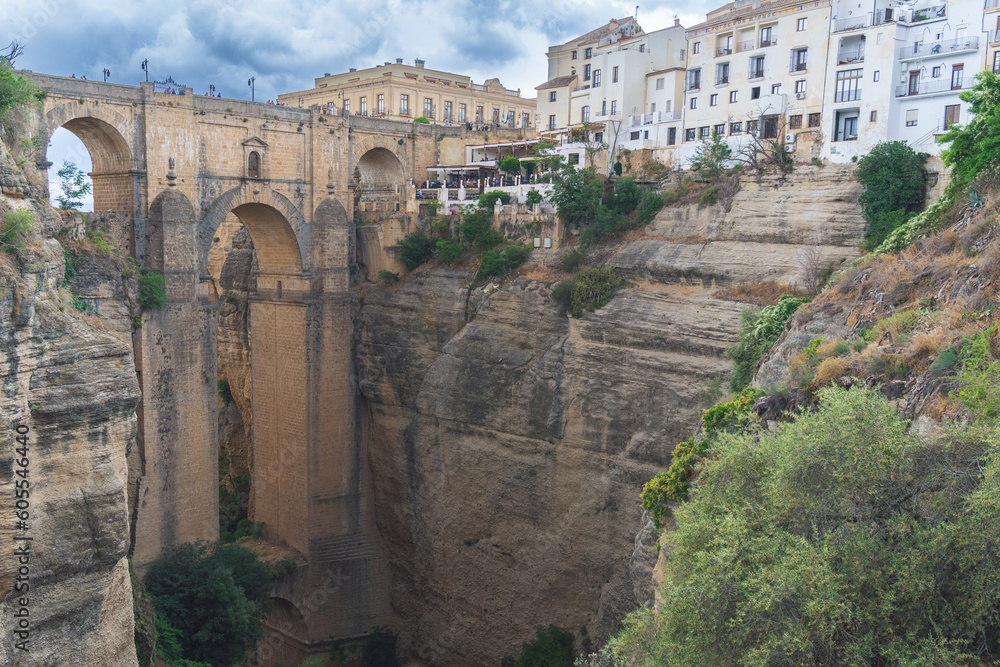 view of the back of the new bridge of ronda ,malaga ,spain a grey cloudy day