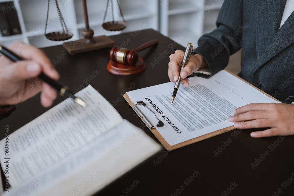 Naklejka premium Attorneys or lawyers who are reading the statute of limitations Consultation between male lawyers and business clients, tax and legal and legal services firms.