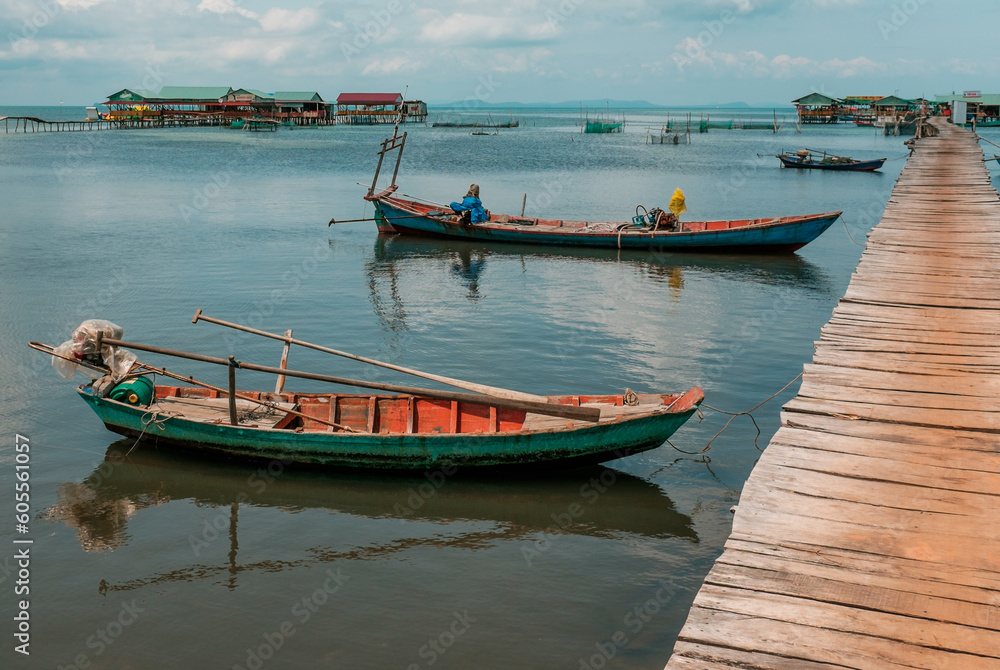 Small fishing boats near a pier in Vietnam